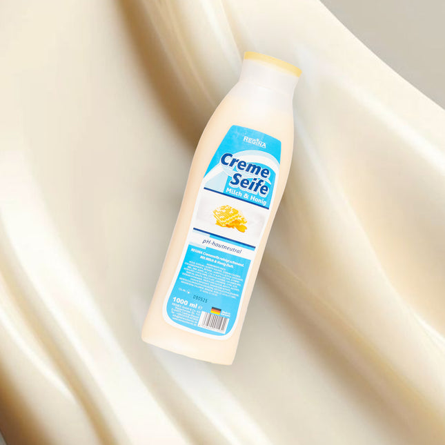 Regina Cremeseife Milch & Honig – pH-hautneutral, 1000 ml Flasche vor seidigem Hintergrund, sanfte Pflege für Haut und Hände

