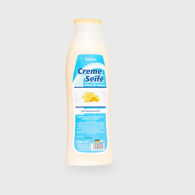 Regina Cremeseife Milch & Honig 1000 ml Flasche auf hellem Hintergrund, pH-hautneutrale Pflegeseife

